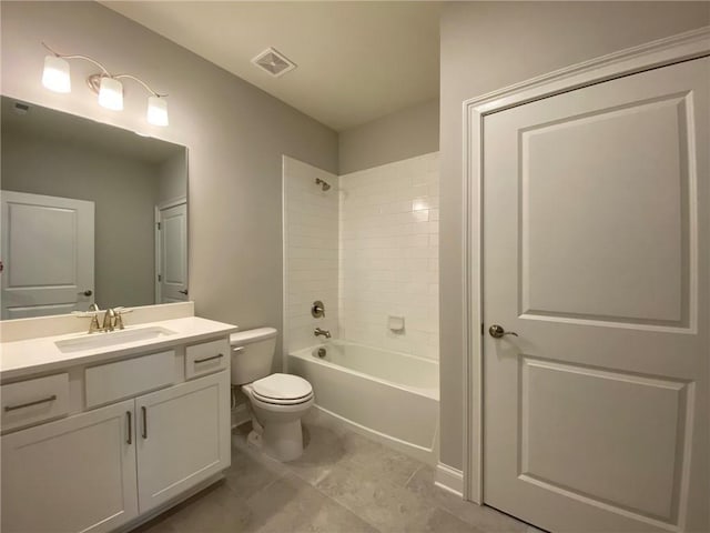 full bathroom with toilet, tiled shower / bath combo, tile patterned flooring, and vanity