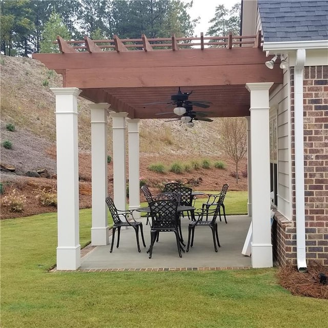 view of patio / terrace featuring ceiling fan and a pergola