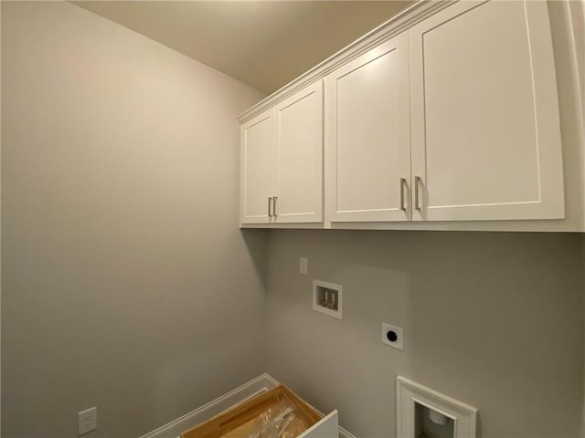 clothes washing area featuring washer hookup, cabinets, and hookup for an electric dryer