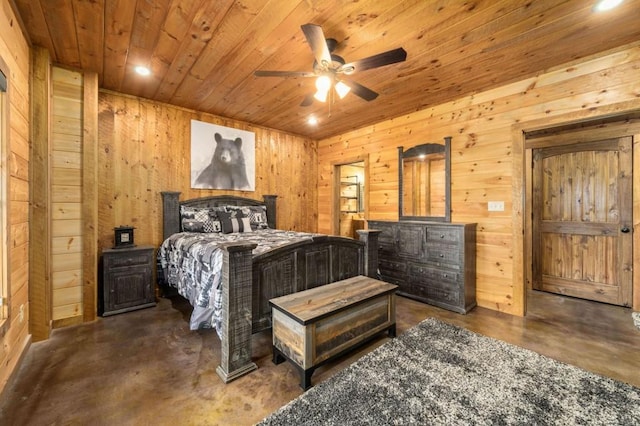 bedroom with wooden walls, wood ceiling, and concrete floors