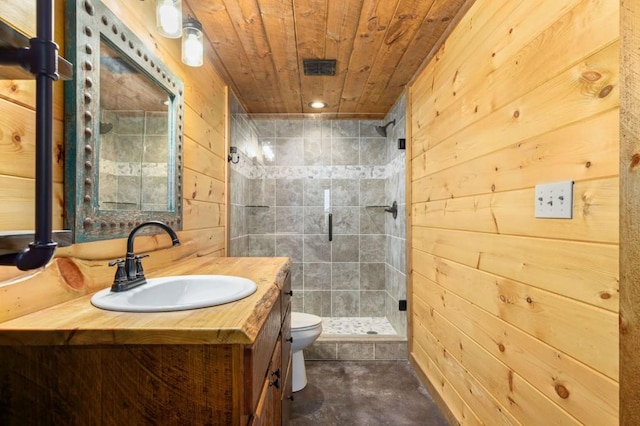 full bath featuring vanity, a shower stall, wood walls, wooden ceiling, and toilet