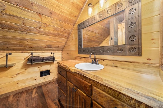 bathroom with wood finished floors, visible vents, lofted ceiling, wood ceiling, and wood walls