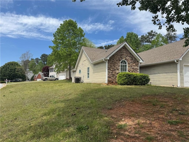 view of home's exterior featuring cooling unit, a lawn, and stone siding