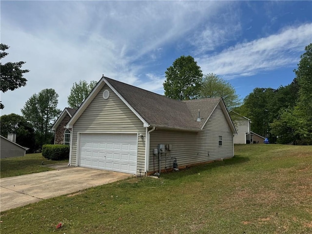 view of side of property with a lawn, an attached garage, driveway, and a shingled roof