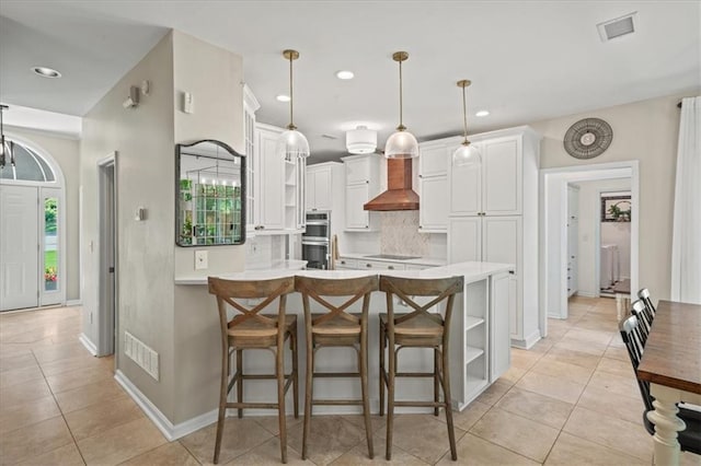230 Bristol Stone Ct, Johns Creek, GA 30005 - kitchen featuring open shelves, a peninsula, wall chimney range hood, backsplash, and recessed lighting