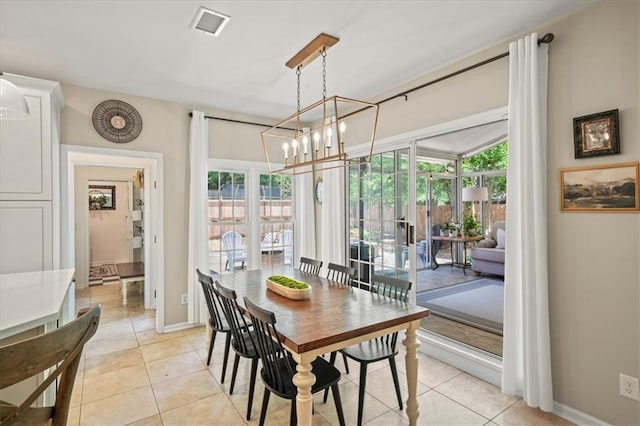 230 Bristol Stone Ct, Johns Creek, GA 30005 - dining space with light tile patterned floors, a chandelier, and baseboards
