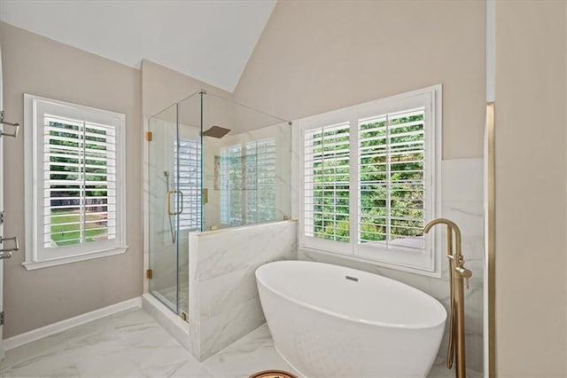 230 Bristol Stone Ct, Johns Creek, GA 30005 - full bathroom featuring marble finish floors, a shower stall, a freestanding tub, lofted ceiling, and baseboards
