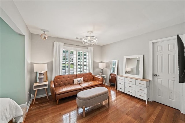 230 Bristol Stone Ct, Johns Creek, GA 30005 - living room featuring a chandelier, wood finished floors, and baseboards