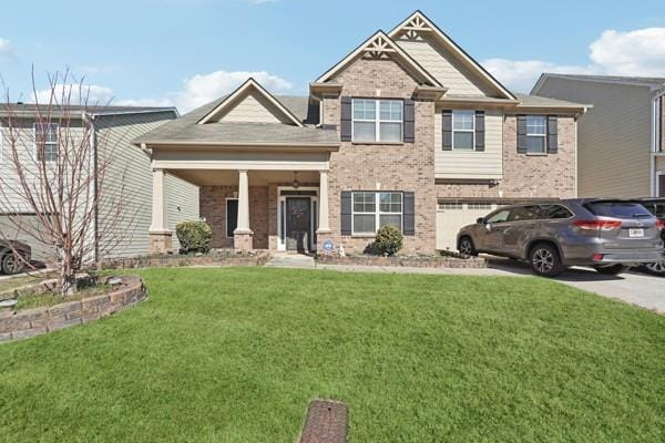 craftsman inspired home featuring an attached garage, brick siding, concrete driveway, and a front yard