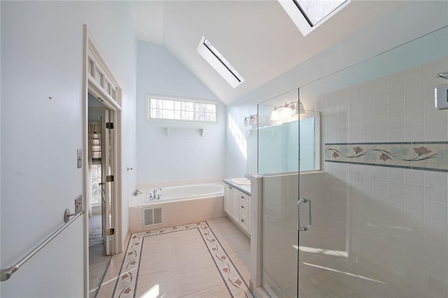 full bathroom with a garden tub, visible vents, a shower stall, tile patterned floors, and lofted ceiling with skylight