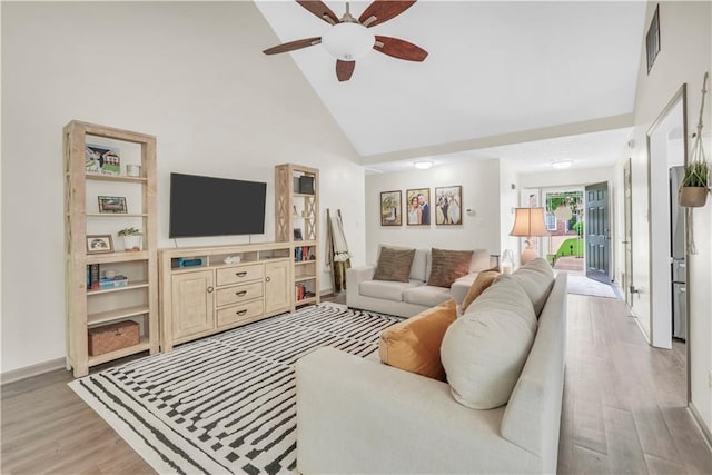 3320 Goldmist Dr, Buford, GA 30519 - living room featuring light wood-style flooring, ceiling fan, high vaulted ceiling, and baseboards
