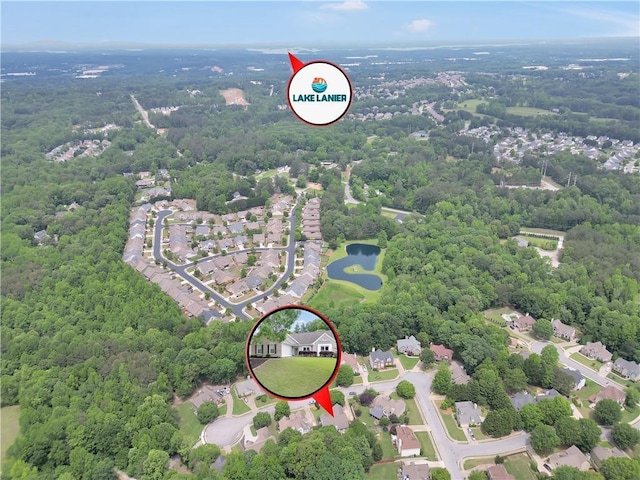 3320 Goldmist Dr, Buford, GA 30519 - aerial perspective of suburban area featuring a nearby body of water and a heavily wooded area