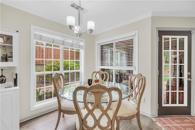 3320 Goldmist Dr, Buford, GA 30519 - dining area with a chandelier, light wood-style floors, and baseboards
