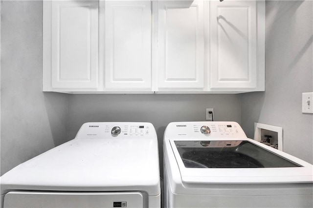3320 Goldmist Dr, Buford, GA 30519 - washroom featuring washer and clothes dryer and cabinet space