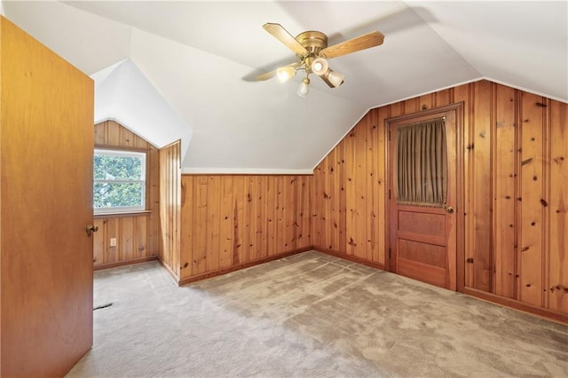 357 W Hightower Trl, Social Circle, GA 30025 - additional living space featuring vaulted ceiling, carpet flooring, ceiling fan, and wood walls