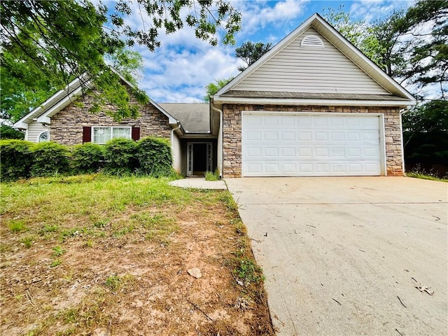 1528 Buckingham Pl, Stockbridge, GA 30281 - view of front facade featuring stone siding, concrete driveway, and an attached garage