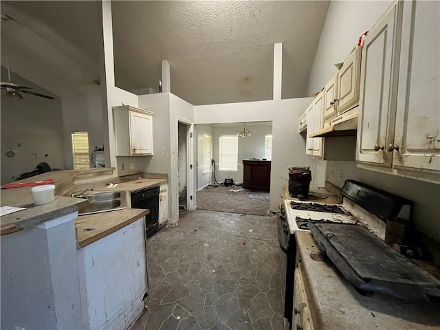 1528 Buckingham Pl, Stockbridge, GA 30281 - kitchen featuring gas range, a sink, vaulted ceiling, black dishwasher, and light countertops