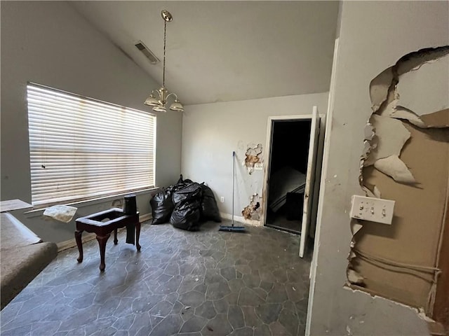 1528 Buckingham Pl, Stockbridge, GA 30281 - dining room with lofted ceiling, stone floors, a chandelier, and baseboards