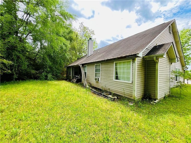 1528 Buckingham Pl, Stockbridge, GA 30281 - view of property exterior with a chimney and a lawn