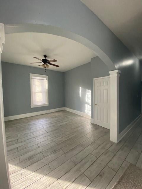 empty room with light hardwood / wood-style floors and ceiling fan