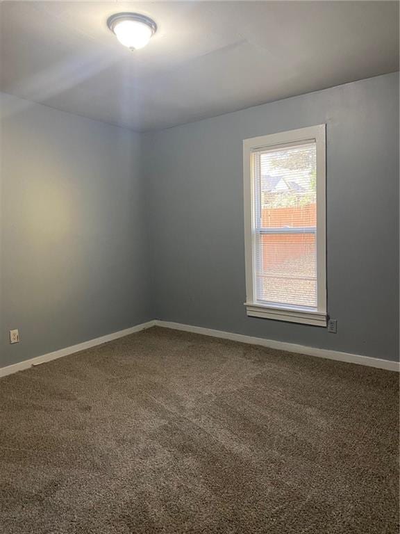 spare room featuring carpet flooring