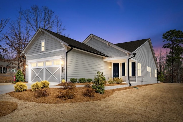 view of front facade with a garage and concrete driveway