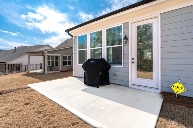 exterior space with a patio and fence