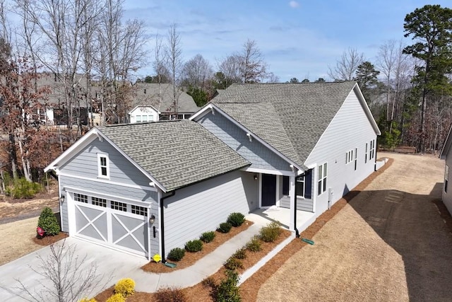 view of front of property featuring roof with shingles