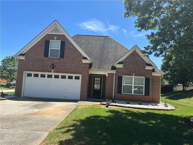 1266 Laurelwood Ct, Lawrenceville, GA 30045 - traditional-style home featuring driveway, brick siding, a front yard, and a shingled roof