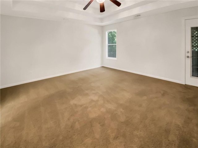 131 Morningside Dr, Jackson, GA 30233 - carpeted empty room with a tray ceiling and a ceiling fan