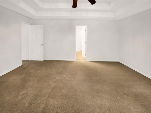 131 Morningside Dr, Jackson, GA 30233 - empty room featuring a tray ceiling, carpet floors, and ceiling fan