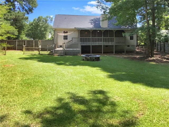 131 Morningside Dr, Jackson, GA 30233 - rear view of property featuring a sunroom, a fenced backyard, a deck, crawl space, and a chimney