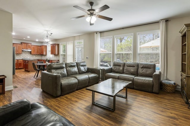 living area with ceiling fan, baseboards, wood finished floors, and recessed lighting