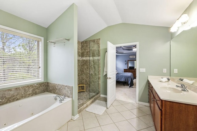 ensuite bathroom with ensuite bathroom, lofted ceiling, vanity, a shower stall, and a whirlpool tub