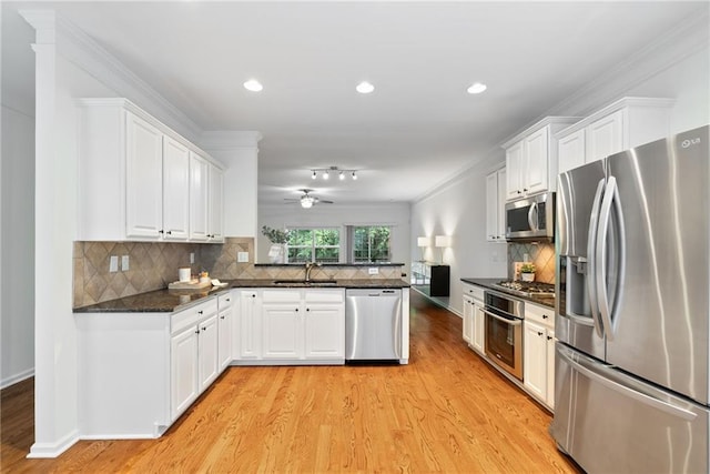 651 Coligny Ct, Atlanta, GA 30350 - kitchen featuring stainless steel appliances, light wood-style floors, white cabinetry, a ceiling fan, and a peninsula