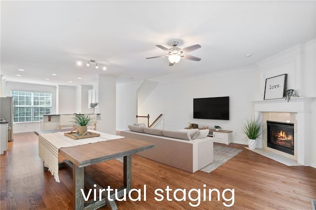 651 Coligny Ct, Atlanta, GA 30350 - living area with light wood finished floors, a premium fireplace, a ceiling fan, and crown molding