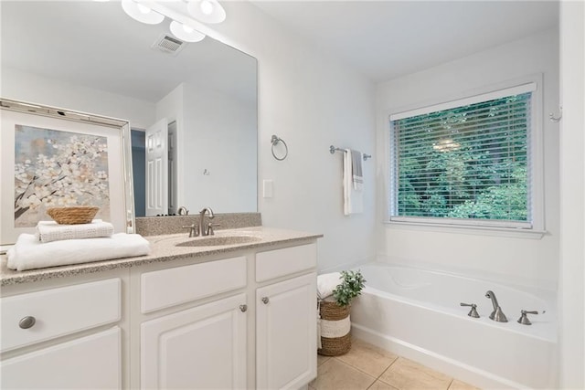 651 Coligny Ct, Atlanta, GA 30350 - bathroom with vanity, a bath, and tile patterned flooring