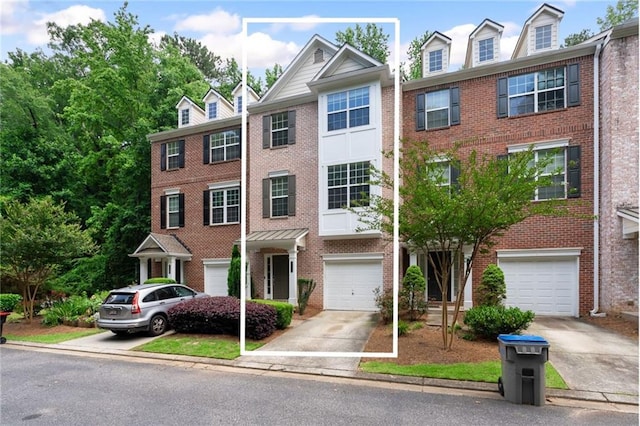 651 Coligny Ct, Atlanta, GA 30350 - view of property with driveway, brick siding, and an attached garage