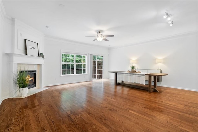 651 Coligny Ct, Atlanta, GA 30350 - unfurnished living room featuring ceiling fan, ornamental molding, a fireplace, and wood finished floors
