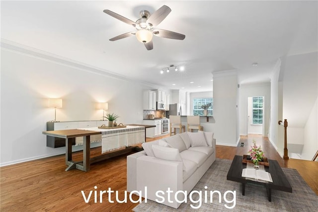 651 Coligny Ct, Atlanta, GA 30350 - living area with ornamental molding, wood finished floors, and a ceiling fan