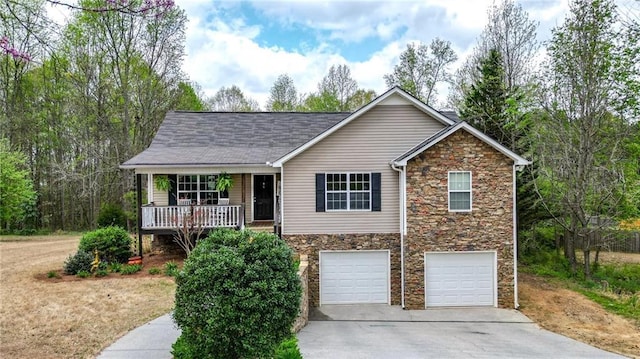 192 Aubrey Ave NE, Calhoun, GA 30701 - view of front of home featuring stone siding, a garage, concrete driveway, and a porch