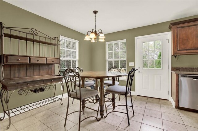 192 Aubrey Ave NE, Calhoun, GA 30701 - dining space featuring light tile patterned floors, baseboards, a chandelier, and a wealth of natural light