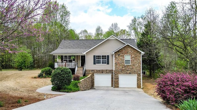 192 Aubrey Ave NE, Calhoun, GA 30701 - ranch-style home with stone siding, covered porch, a garage, and concrete driveway