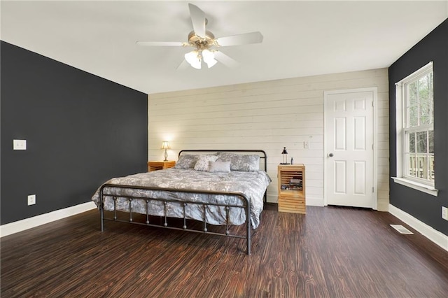 192 Aubrey Ave NE, Calhoun, GA 30701 - bedroom featuring baseboards, a ceiling fan, wood finished floors, and an accent wall