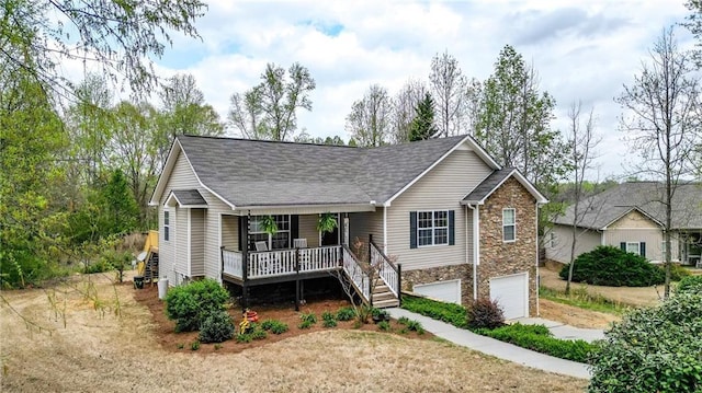 192 Aubrey Ave NE, Calhoun, GA 30701 - ranch-style house featuring stone siding, a garage, concrete driveway, stairway, and covered porch
