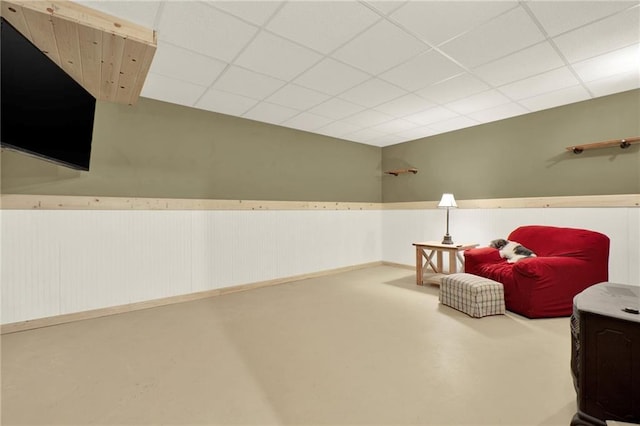 192 Aubrey Ave NE, Calhoun, GA 30701 - sitting room with a wainscoted wall, concrete floors, and a paneled ceiling
