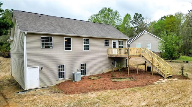 192 Aubrey Ave NE, Calhoun, GA 30701 - rear view of house featuring a shingled roof, central AC, stairway, and a wooden deck