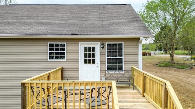 192 Aubrey Ave NE, Calhoun, GA 30701 - view of exterior entry with a deck and roof with shingles