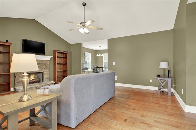 192 Aubrey Ave NE, Calhoun, GA 30701 - living area featuring light wood finished floors, baseboards, a fireplace, ceiling fan, and lofted ceiling