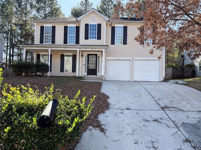 view of front of home featuring covered porch and a garage